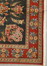 Load image into Gallery viewer, close up view of a Qom Handknotted rug&#39;s  bottom left corner floral border