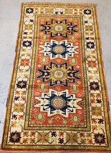 Load image into Gallery viewer, Full view of this Caucasion rug thin sage colored guards and white main border