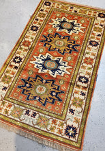 Load image into Gallery viewer, full view of this Handknotted rug from top left or lighter side of the carpet